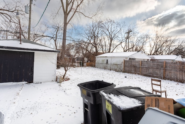 view of yard layered in snow