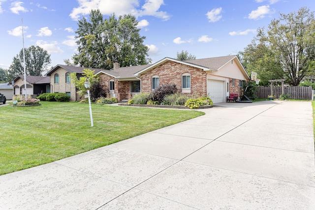 ranch-style house featuring a garage and a front yard