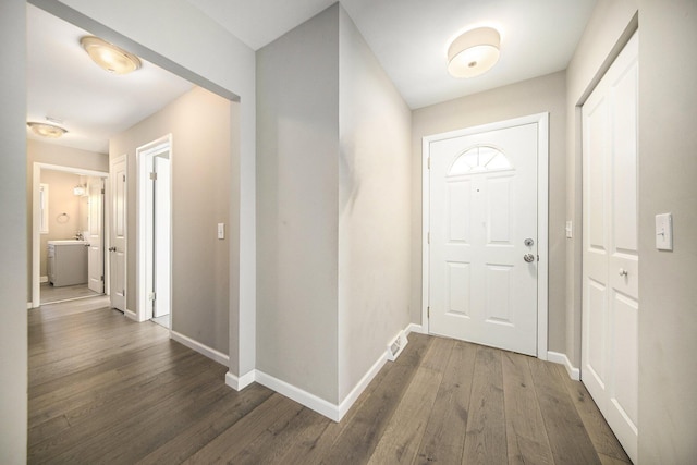 foyer with dark hardwood / wood-style flooring