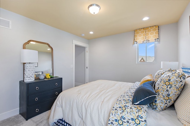 bedroom with light colored carpet