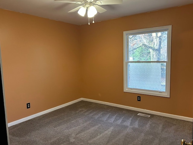 empty room with carpet and ceiling fan