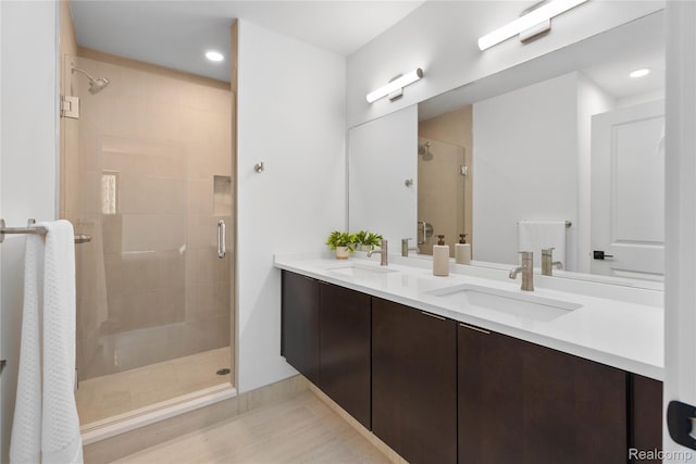 3422 Cochrane St Unit 1, Detroit, MI 48208 - bathroom featuring double vanity, a stall shower, and recessed lighting