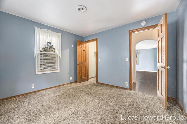 unfurnished bedroom featuring carpet