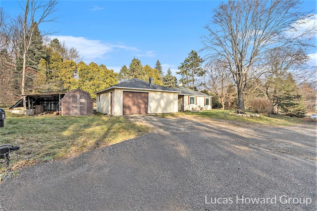 ranch-style home featuring an outbuilding