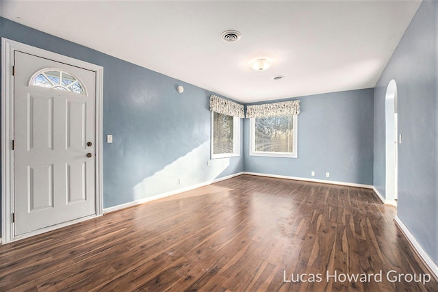 foyer entrance with dark hardwood / wood-style flooring