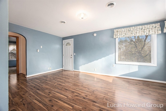 empty room featuring dark hardwood / wood-style floors