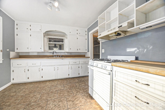 kitchen featuring white cabinets, white gas stove, and sink