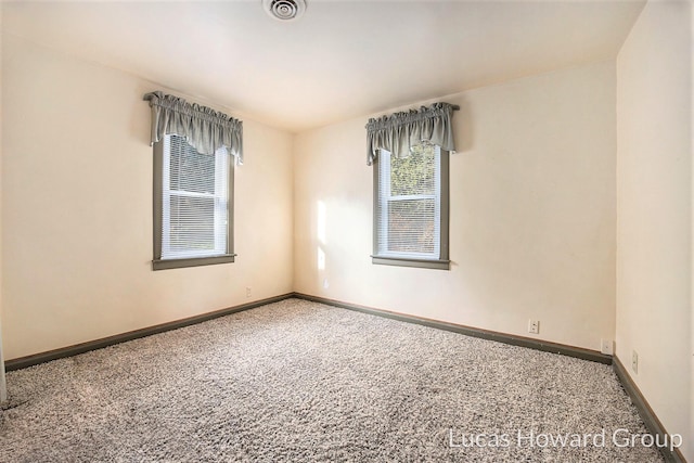 spare room with carpet floors