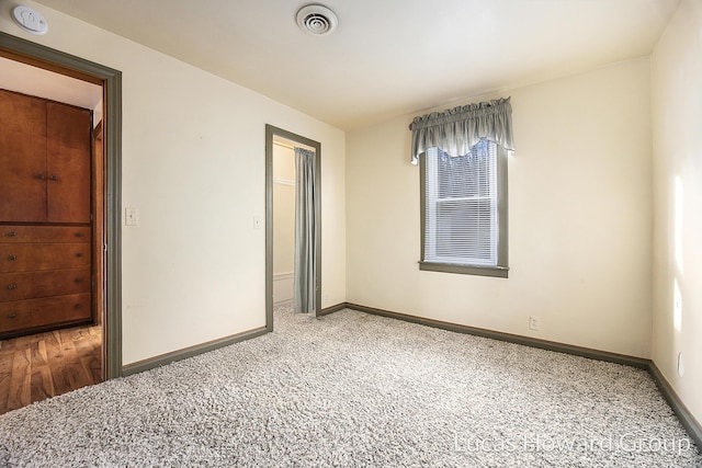 unfurnished room with carpet floors