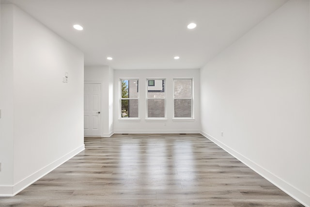 spare room featuring light hardwood / wood-style floors