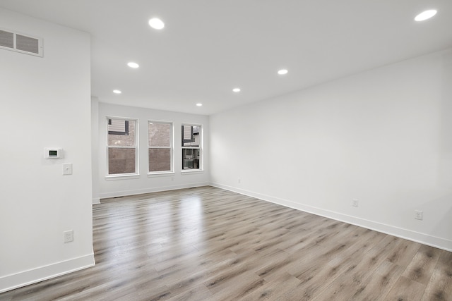 spare room featuring light hardwood / wood-style floors