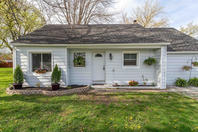 ranch-style home featuring a front yard