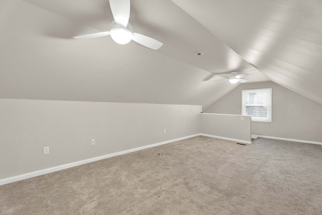 bonus room featuring carpet flooring, ceiling fan, and vaulted ceiling