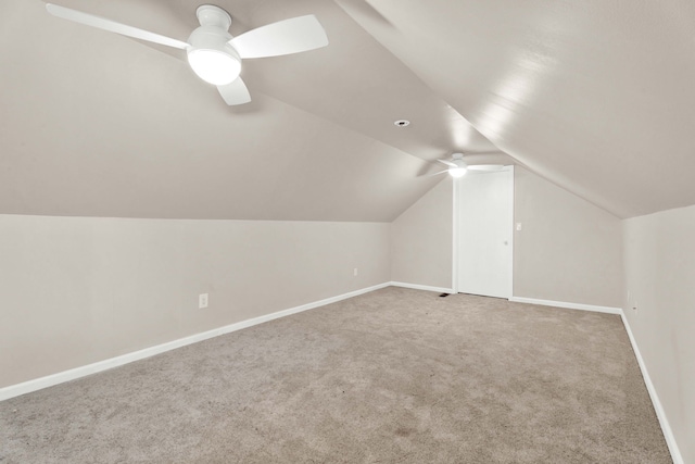 bonus room with carpet flooring, vaulted ceiling, and ceiling fan