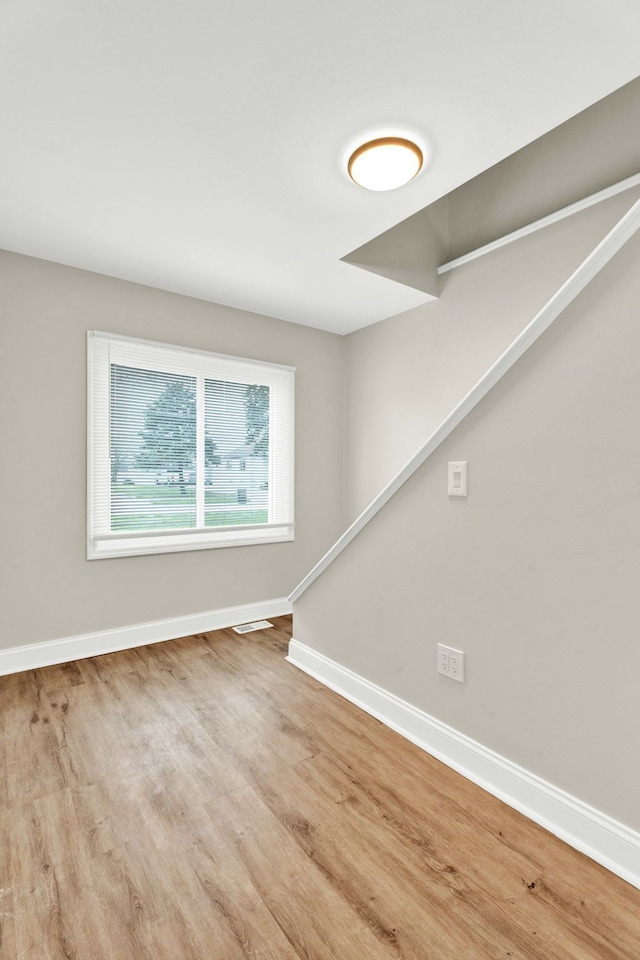 unfurnished room featuring light hardwood / wood-style flooring