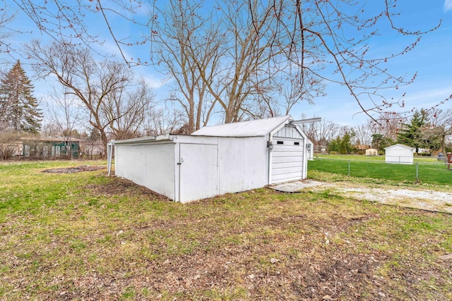 view of outdoor structure with a lawn