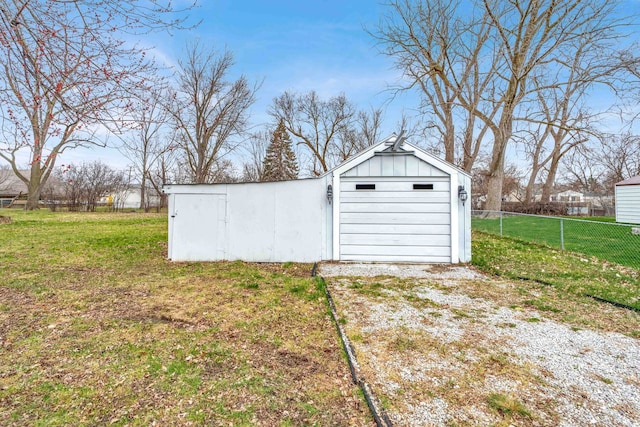 view of outbuilding featuring a lawn