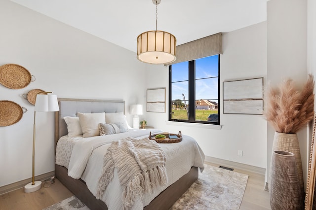 bedroom with light hardwood / wood-style floors