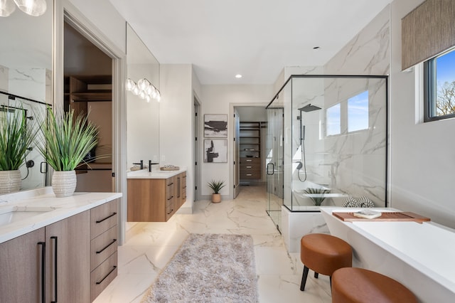 bathroom with vanity and a shower with shower door