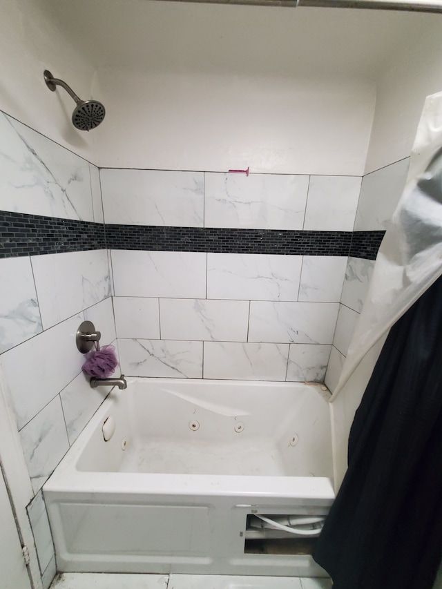 bathroom featuring shower / bathtub combination with curtain