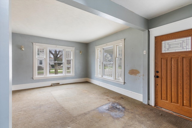 view of carpeted entrance foyer