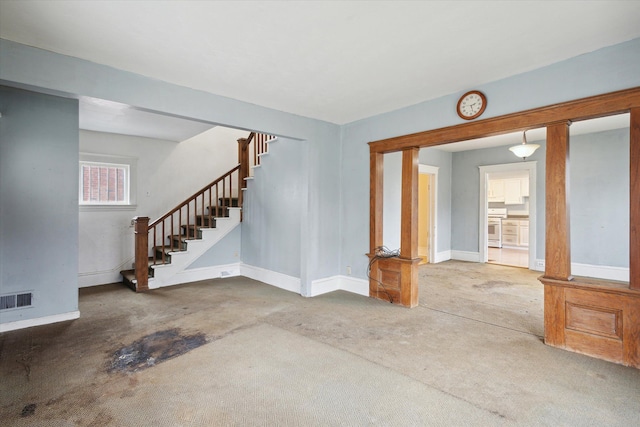 unfurnished living room featuring carpet floors