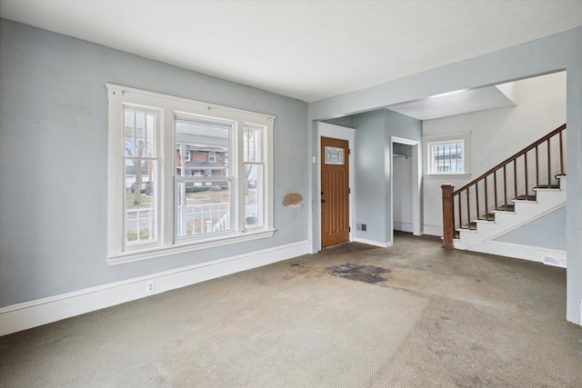 carpeted entrance foyer with plenty of natural light