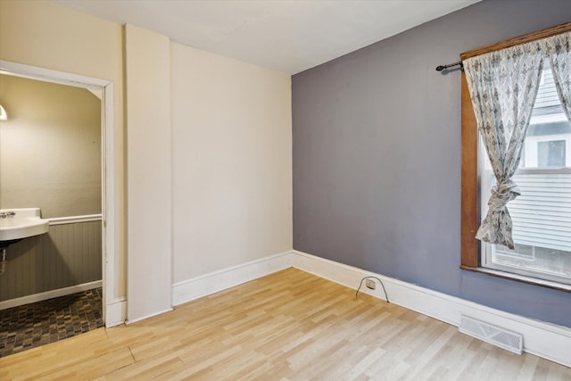 spare room featuring hardwood / wood-style floors