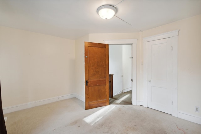 empty room featuring light colored carpet