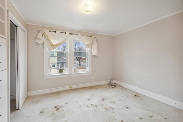 unfurnished room featuring carpet flooring and ornamental molding