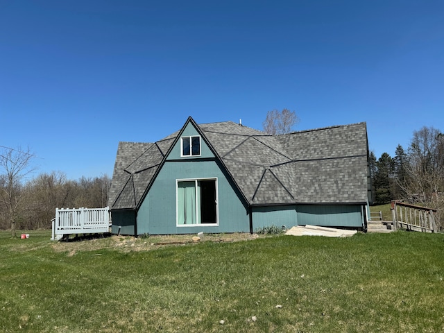 view of outbuilding with a lawn