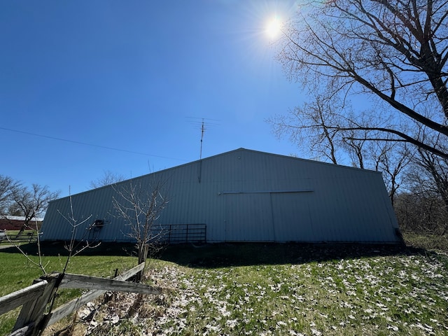 view of outbuilding with a yard