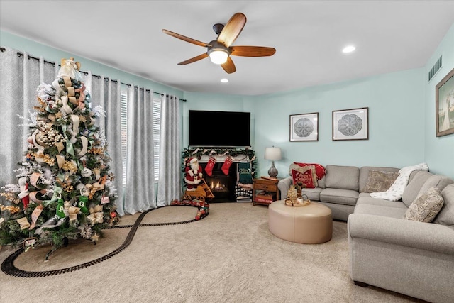 living room with carpet and ceiling fan