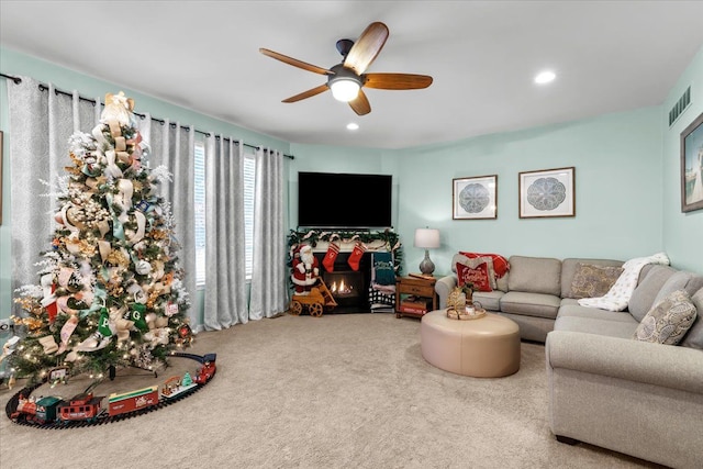 living room with carpet flooring and ceiling fan