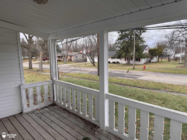 wooden terrace featuring a porch