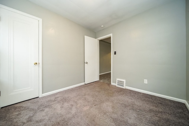 unfurnished bedroom with carpet flooring