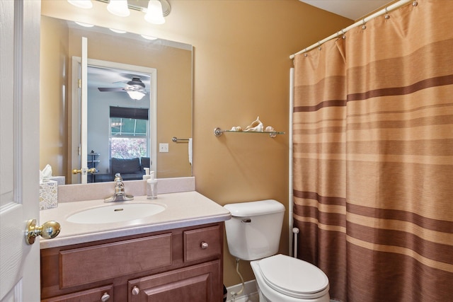 ensuite bathroom with toilet, curtained shower, vanity, and ensuite bathroom