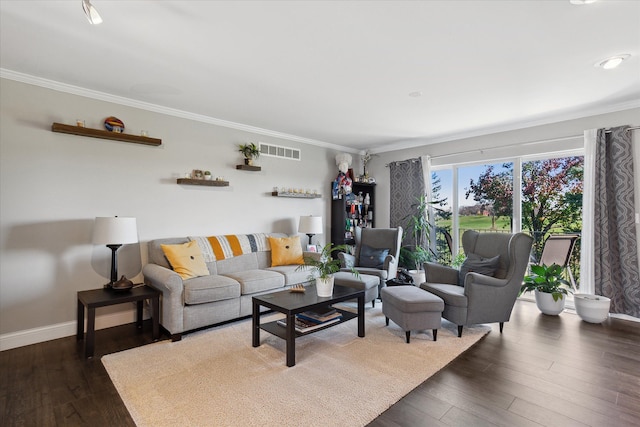 living area featuring dark wood-type flooring, visible vents, ornamental molding, and baseboards