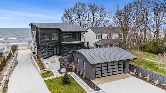 view of front of property featuring a water view and a garage