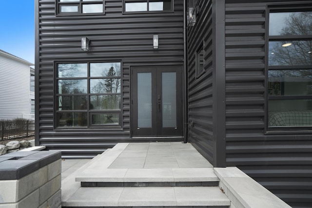 view of exterior entry featuring french doors