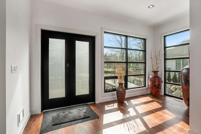 interior space featuring hardwood / wood-style floors and french doors