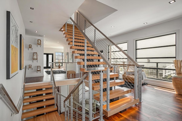 stairs with hardwood / wood-style flooring