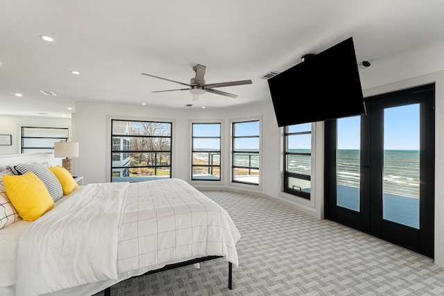 carpeted bedroom featuring french doors, access to outside, and ceiling fan