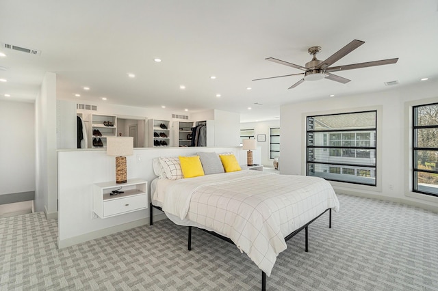 bedroom featuring ceiling fan and light colored carpet