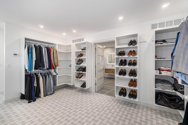 spacious closet featuring carpet floors