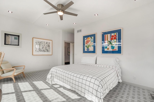 bedroom with ceiling fan and light colored carpet