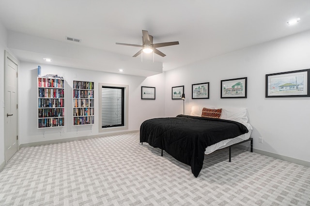 carpeted bedroom with ceiling fan