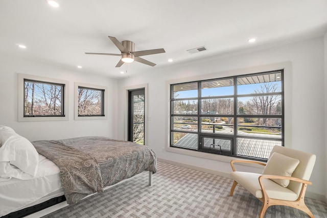 carpeted bedroom featuring ceiling fan