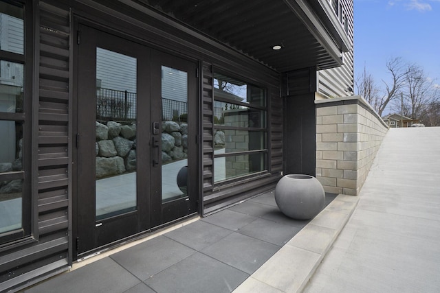 view of exterior entry featuring french doors