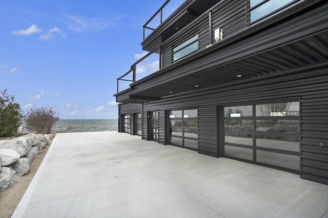 view of side of home featuring a water view